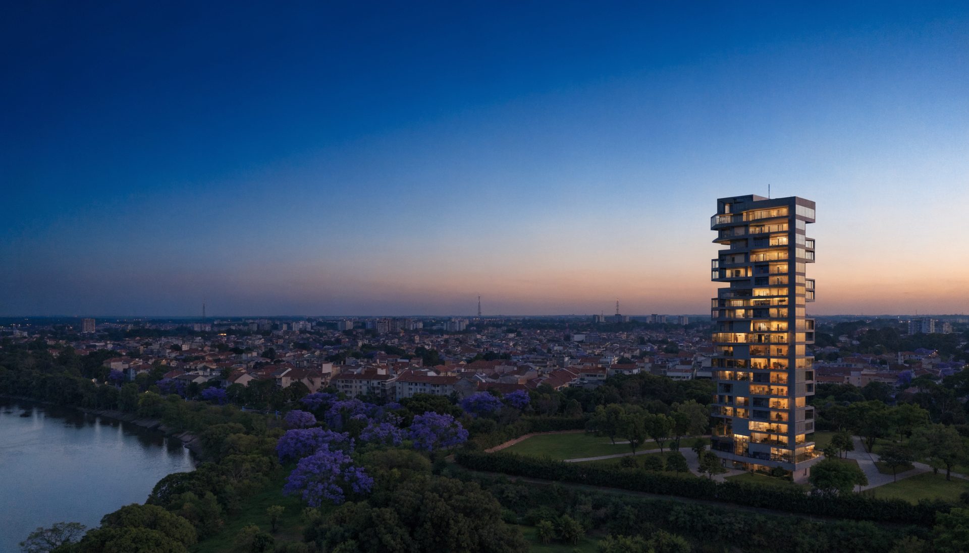 Torre residencial de 50 plantas al atardecer sobre Asunción
